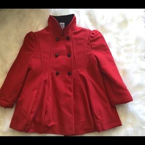 Red PeaCoat with black buttons.
